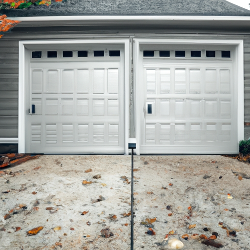Suburban Carlisle, MA home with a closed modern garage door, driveway, and autumn foliage in soft daylight.
